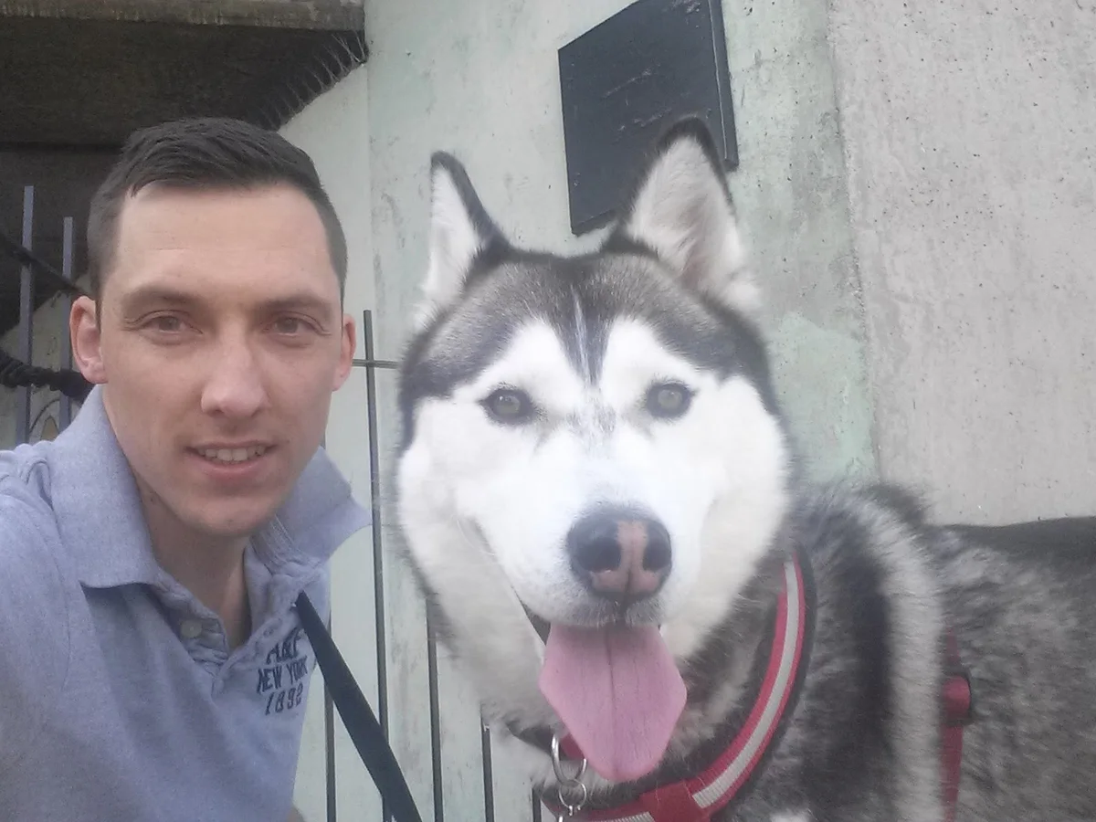 Chris with a dog outdoors