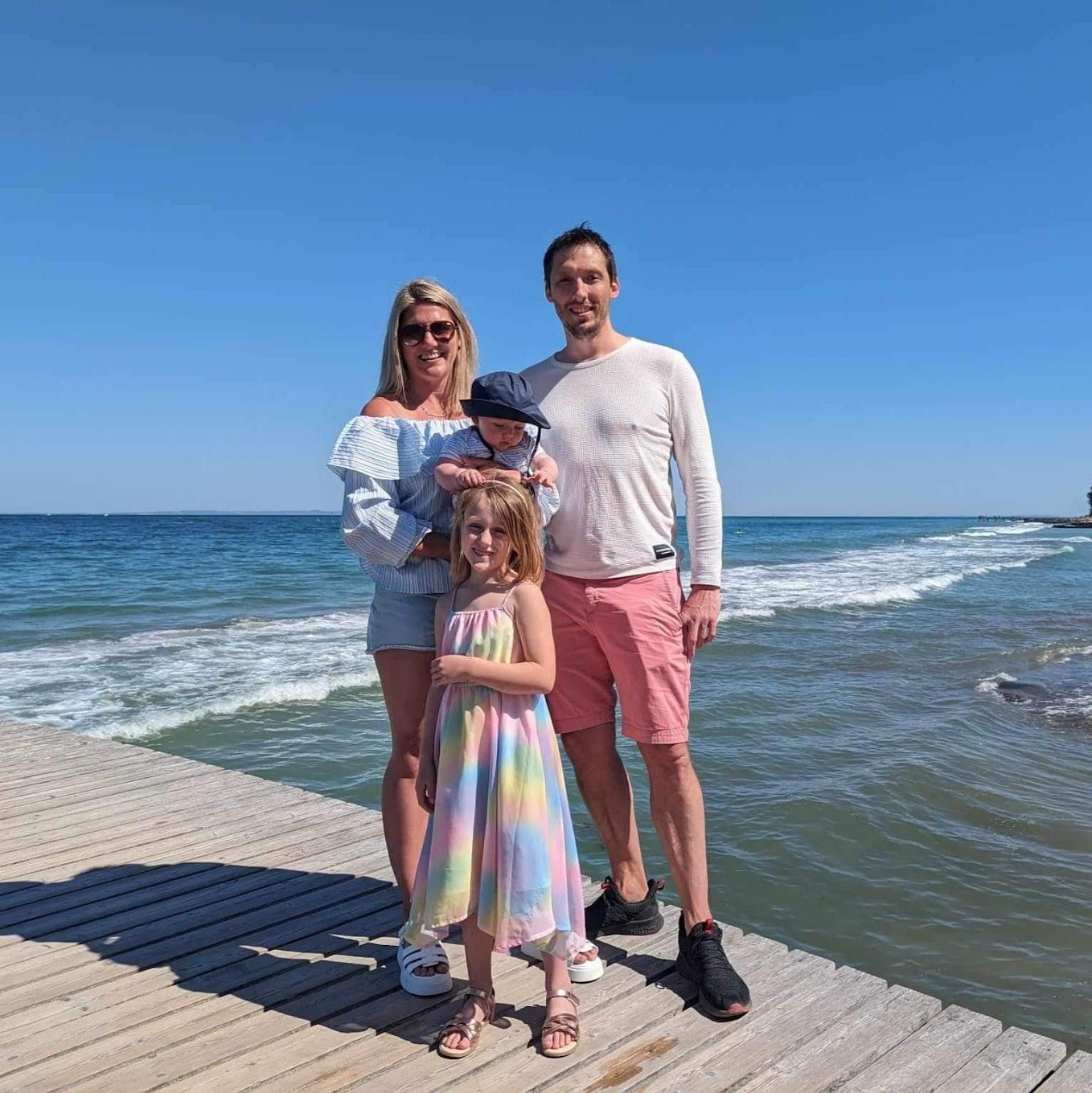 Chris Pearson with his family by the sea